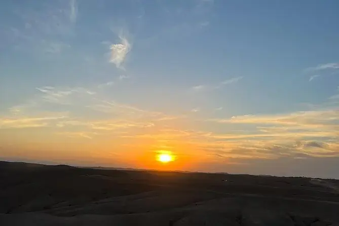 Rolling stone hills of the Agafay Desert in warm sunset light